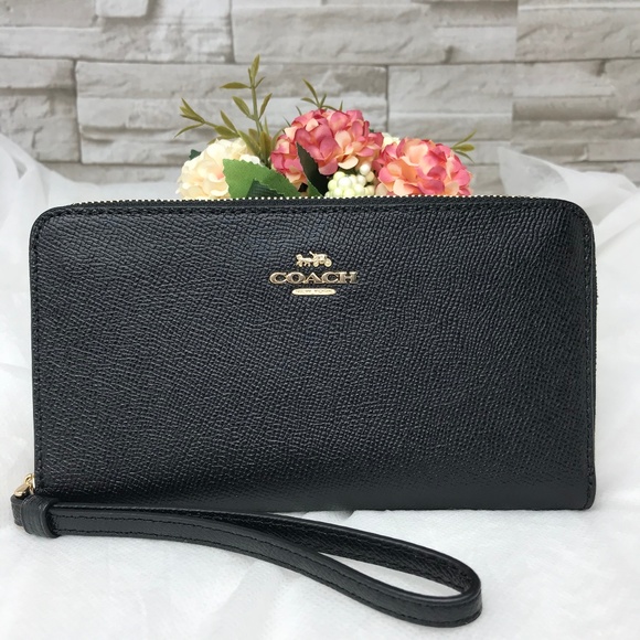 Coach Handbags - 👜 ‼️SALE‼️ 🌺LARGE PHONE WALLET 7 1/4"